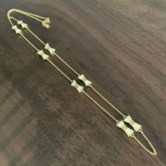 KATE Spade enamel/gold bow gold tone chain necklace